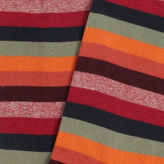 Close-up of striped fabric with red, green, orange, and black colors.