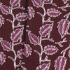 Close-up of fabric with a leaf pattern on a dark background
