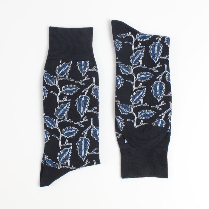 Black socks with blue leaf pattern on a white background