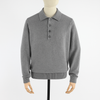 Gray sweater with button collar on a mannequin against a white background
