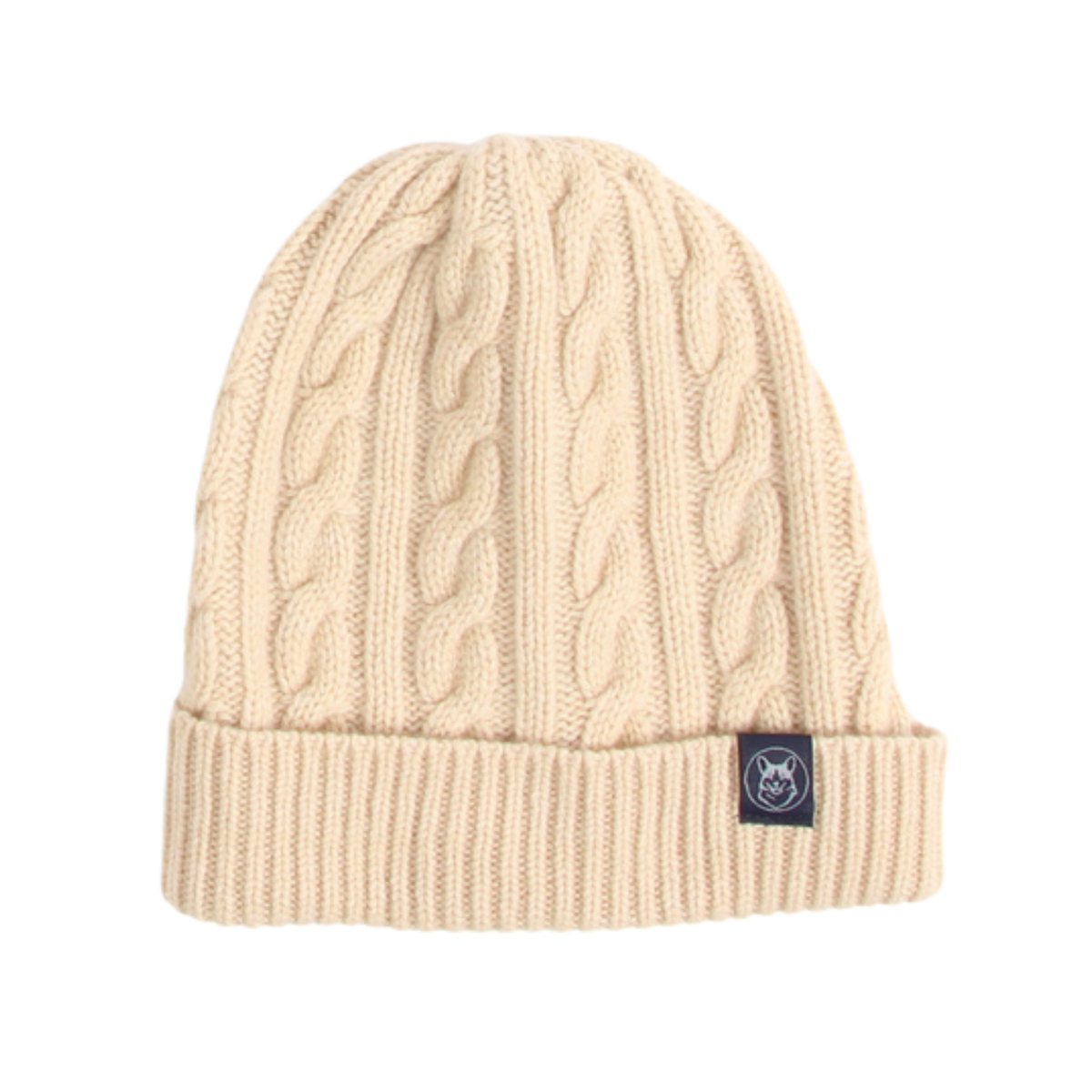 A cream-colored cable-knit beanie hat with a ribbed cuff and a small dark brand patch on the side, shown against a plain white background.