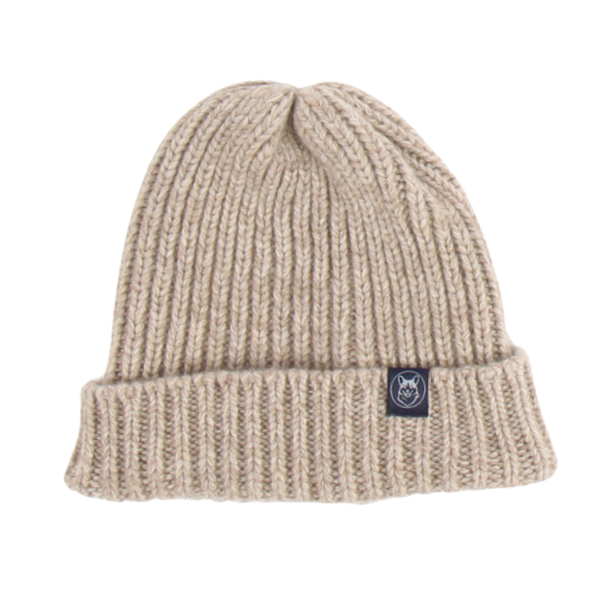 A beige ribbed knit beanie hat with a folded cuff and a small black brand patch on the side, shown against a plain white background.