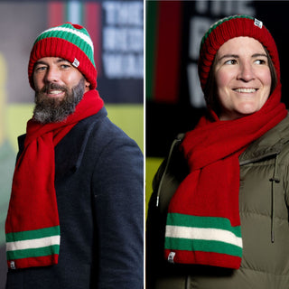 Red Wall scarves being worn by a man and woman.