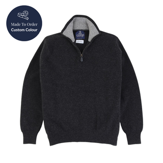 navy half zip sweater with a visible brand label on a white background