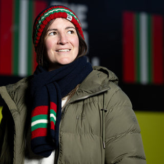 Woman wearing the Red Wall hat and scarf set.