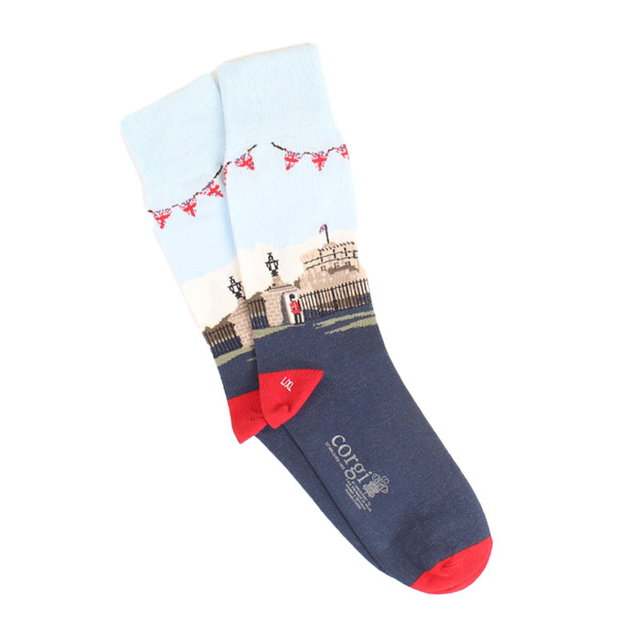 A pair of men's socks with a detailed illustration of Windsor Castle, featuring a predominantly white cuff with a red ribbon design, a blue shaft, and red heel.