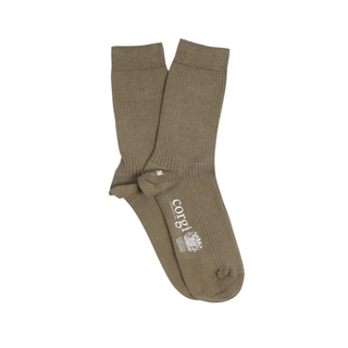 Pair of green socks with a visible brand logo on a white background