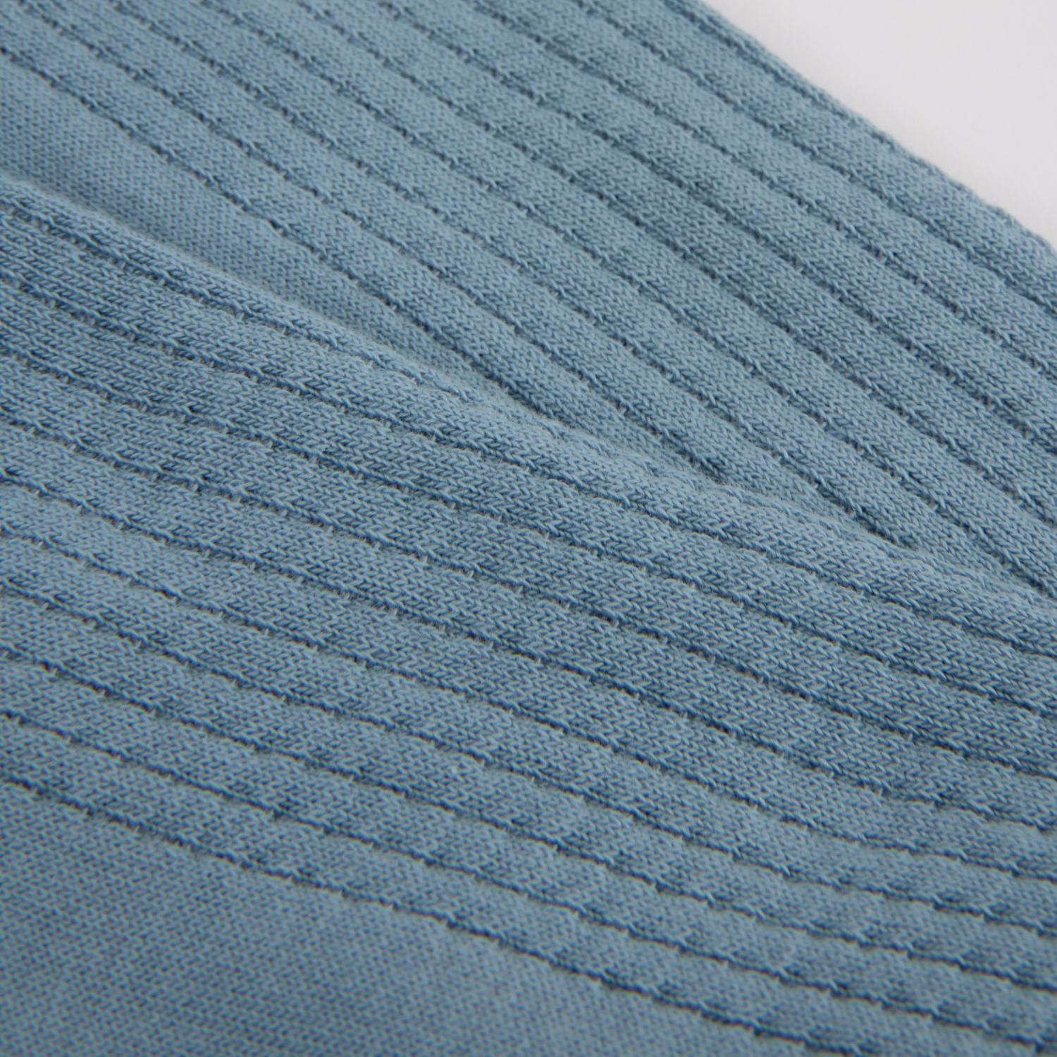 Close-up of a textured blue fabric surface