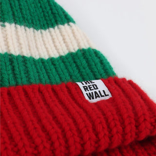 Knitted beanie with green, white, and red stripes and a visible brand label on a white background.