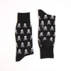 Black socks with white skull and crossbones pattern on a white background
