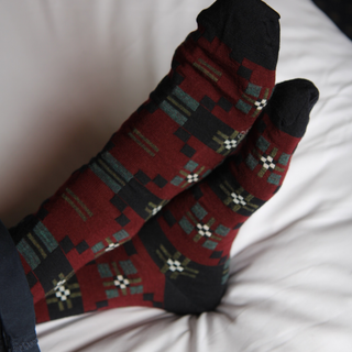Pair of patterned socks on a white surface