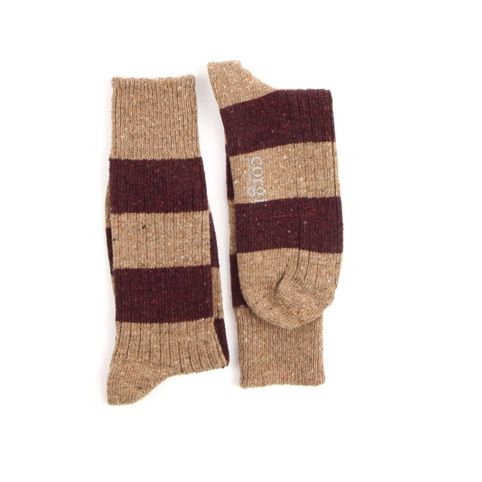 Pair of striped socks with brown and beige pattern on a white background