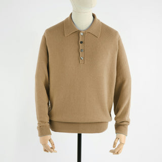 Beige sweater on a mannequin against a white background