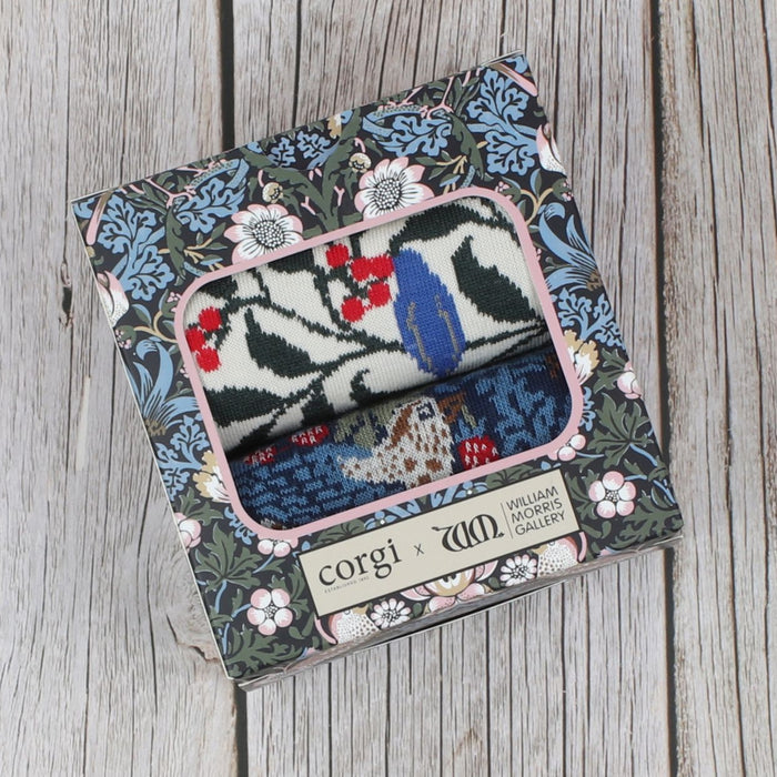 A pair of patterned women's socks displayed in a gift box with the William Morris design.