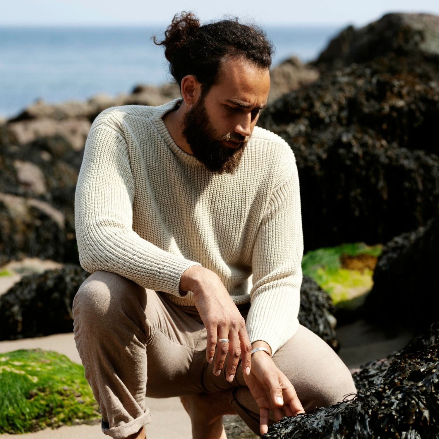 man wearing white linen sweater