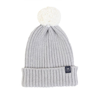 A women's two-tone wool beanie in grey with a plush pom pom on top.