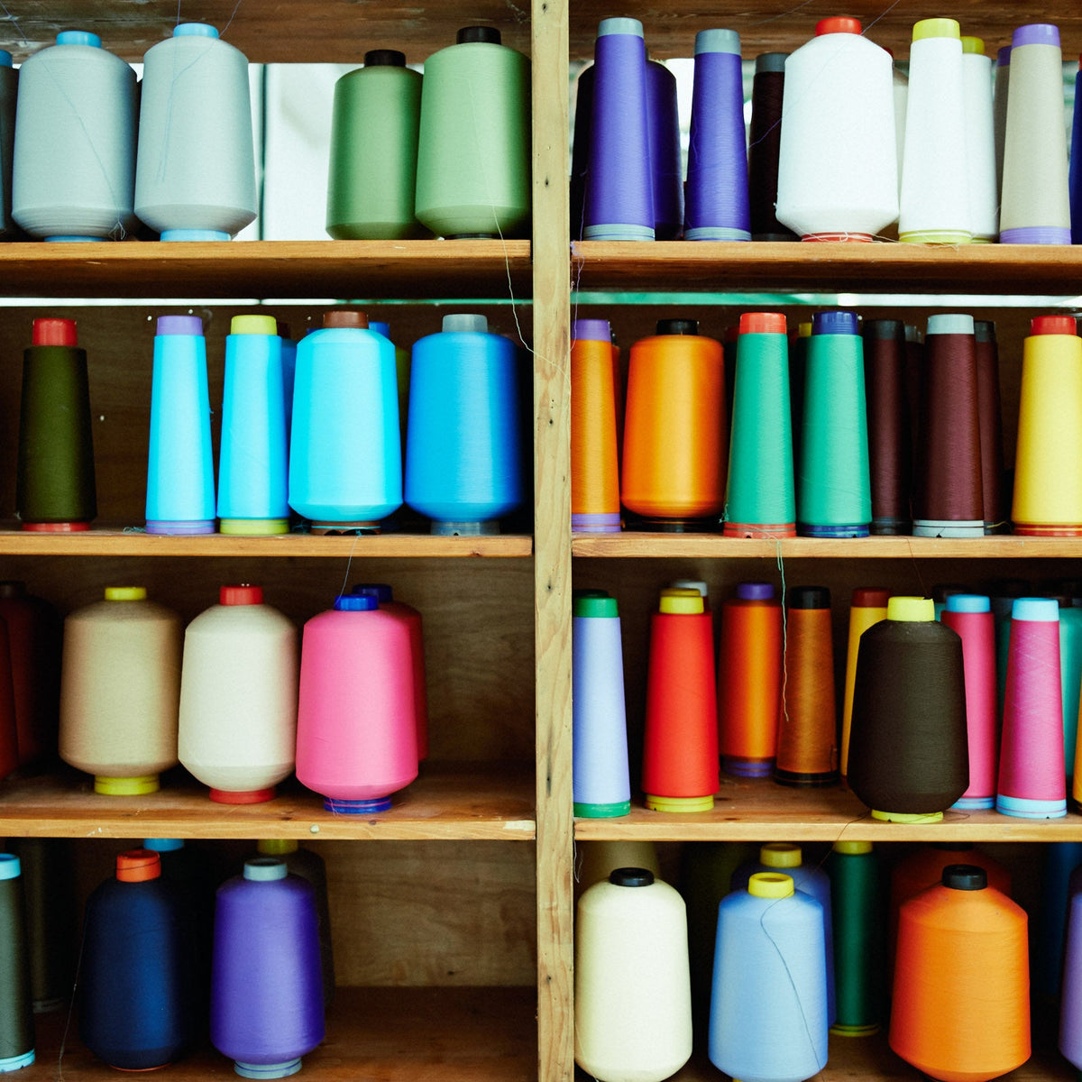 Lots of colourful yarn on a shelf