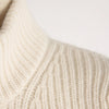 Close-up of beige knitted fabric on a light background
