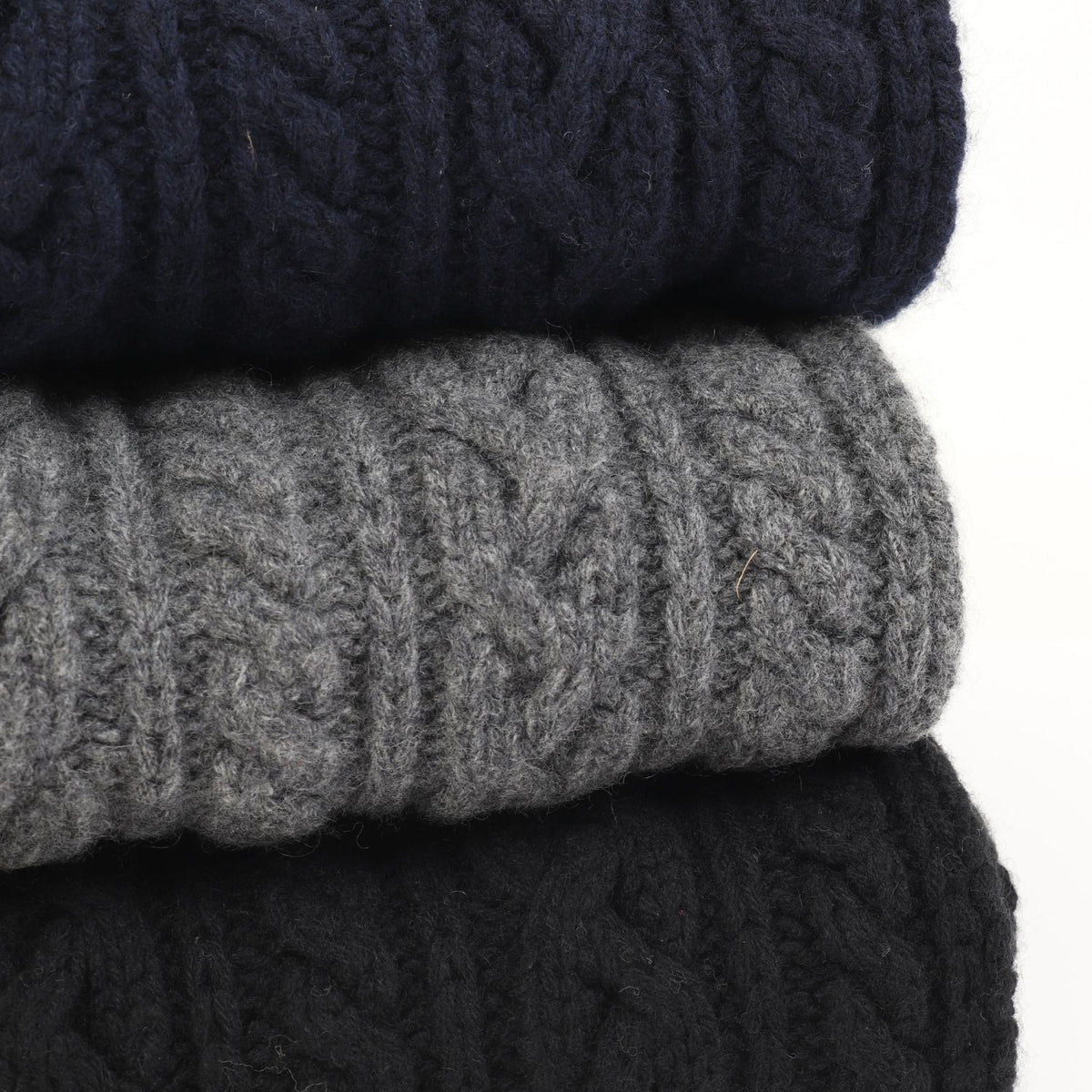 stack of scarves on a white background