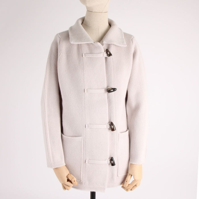 Light gray duffel coat on a mannequin against a white background