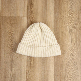 white rib hat on a wooden floor