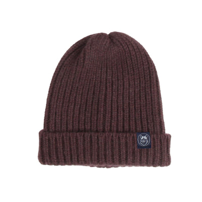 Brown knit beanie with a logo tag on a white background

