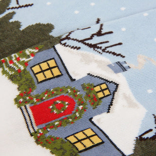 Cross-stitched house with festive decorations on a blue background
