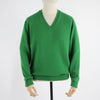 A green men's classic V-neck sweater displayed on a mannequin.