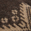 Close-up of a brown fabric with a geometric pattern

