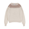 Beige sweater with patterned neckline on a white background