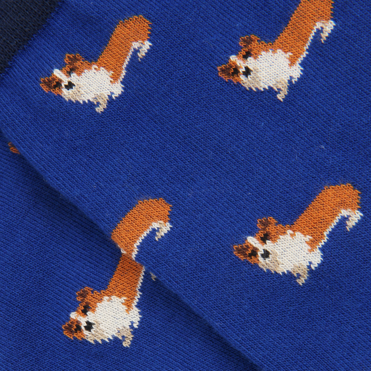Blue sock with brown and white dog pattern