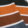 Close-up of striped fabric with orange, brown, white, and blue colors.