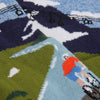 Close-up of a sock with a cyclist peddling up a mountain.
