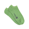 Green socks with 'corgi' branding on a white background