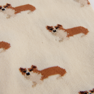 Pattern of small dogs on a beige background