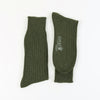 Pair of loden green cashmere ribbed socks on a white background