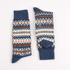 Pair of blue socks with a pattern on a white background