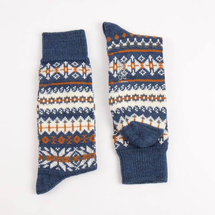 Pair of blue socks with a pattern on a white background