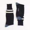 Navy socks with two white stripes and blue accents heel and toe, photographed on a white background