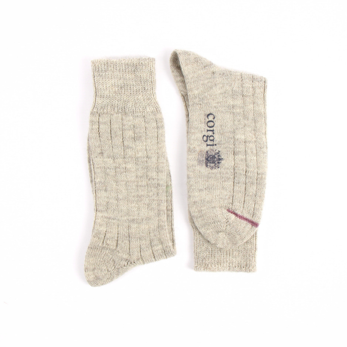 Pair of beige socks with a brand logo on a white background