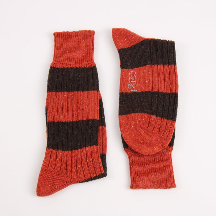 orange and brown striped socks on a white background