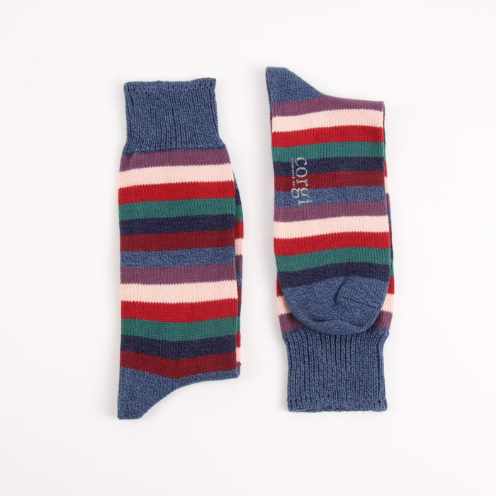 Colorful striped sock with blue cuff on a white background