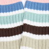 Close-up of striped socks with pink, blue, white, brown, and beige colors.