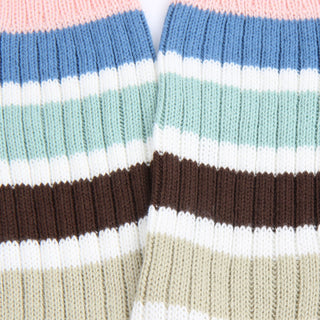 Close-up of striped socks with pink, blue, white, brown, and beige colors.