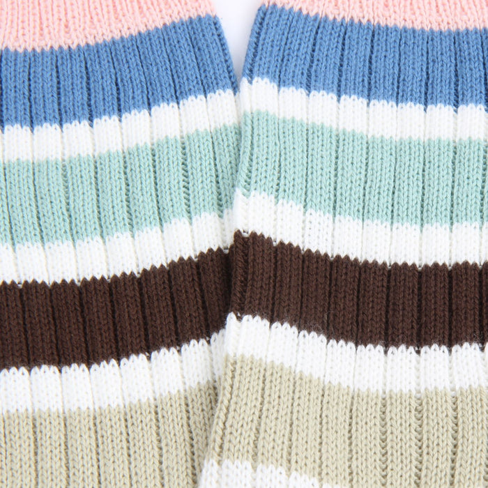 Close-up of striped socks with pink, blue, white, brown, and beige colors.