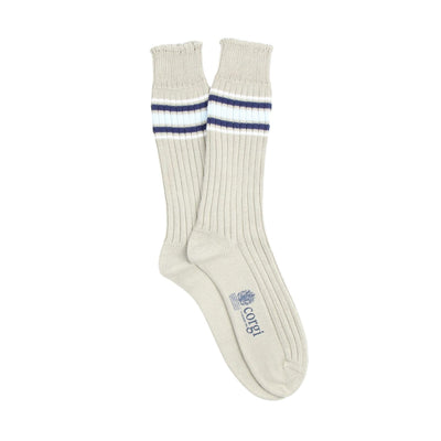 Pair of natural socks with blue and white stripes just below the cuff  on a white background