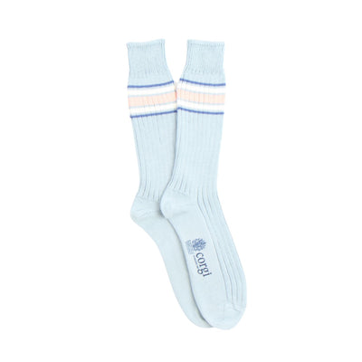 Light blue socks with blue, white and natural stripes on a white background