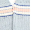 Close-up of striped socks with blue, natural, and white colors.