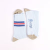 Pair of socks with striped pattern and 'corgi' branding on a white background