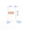 Pair of socks with striped pattern and 'corgi' branding on a white background